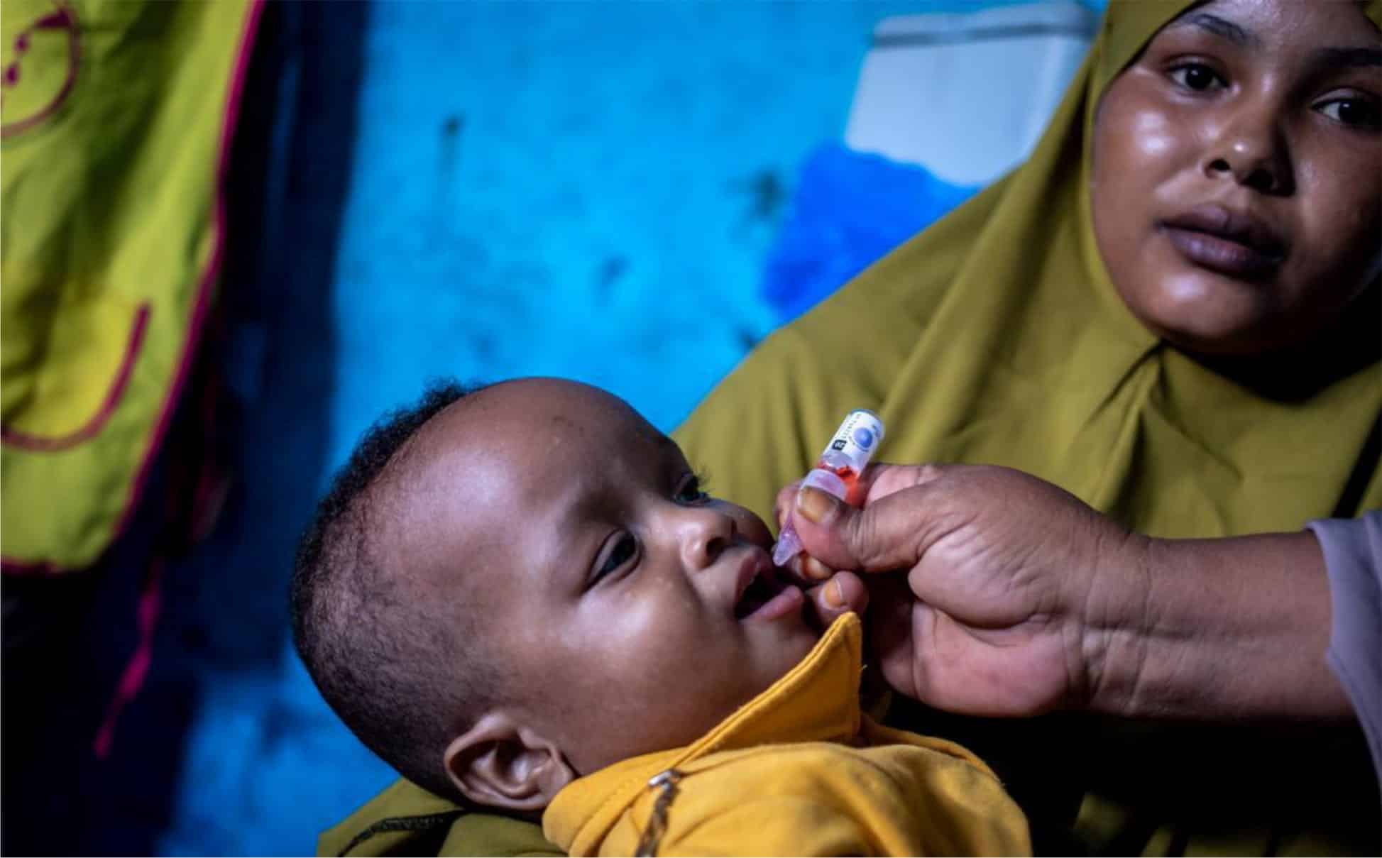 a child being vaccinated in Somalia where immunization campaigns